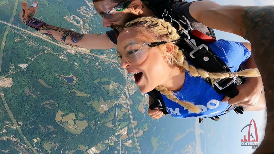 Photos of a cute woman with braids in her hair skydiving for the first time at Skydive STL in St Louis