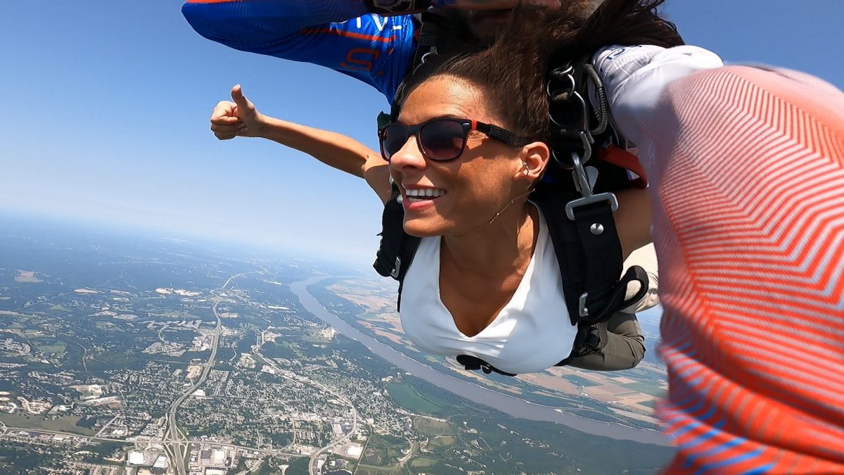 Woman wearing sun glasses while skydiving at Skydive St Louis near Chicago